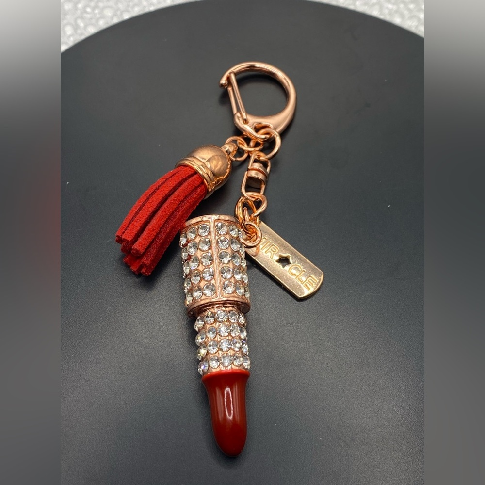 Dark red burgundy lipstick rose gold keychain crystal with tag says miracle